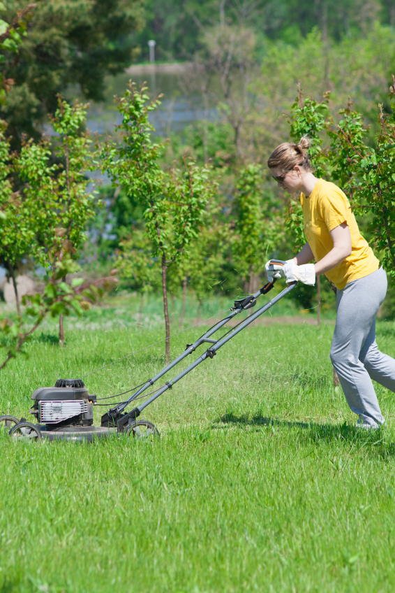 Woman Mowing Grass